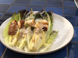 Caesar Salad on a white plate.