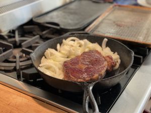 Steak and onions in the pan