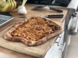 Pizza resting on a cutting board