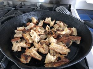 Bread toasting in a cast iron pan