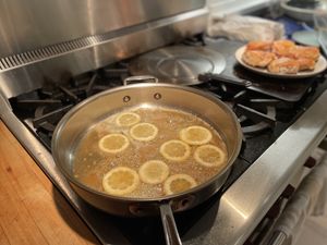 Lemons cooking in a sautee pan