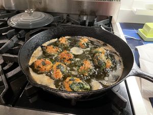 Chicken meatballs cooking on stove