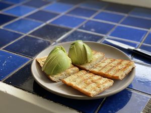Bread with avocado on half