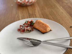 Salmon and salsa fresca on a plate