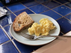 Scrambled eggs and toast on a plate