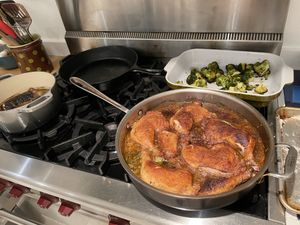Braised chicken legs cooking on the stove
