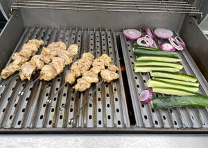 chicken and vegetables on a BBQ