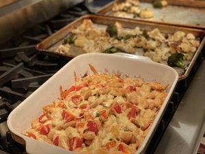 Cassarole with broccoli and cauliflower in the background