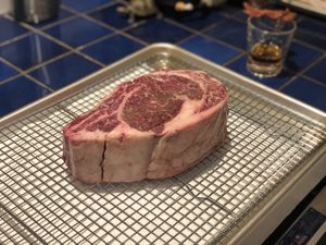 Thick steak on a rack