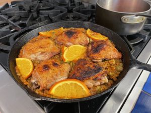 Chicken cooking in a skillet