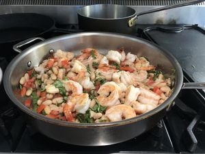 Shrimp cooking in a large pan